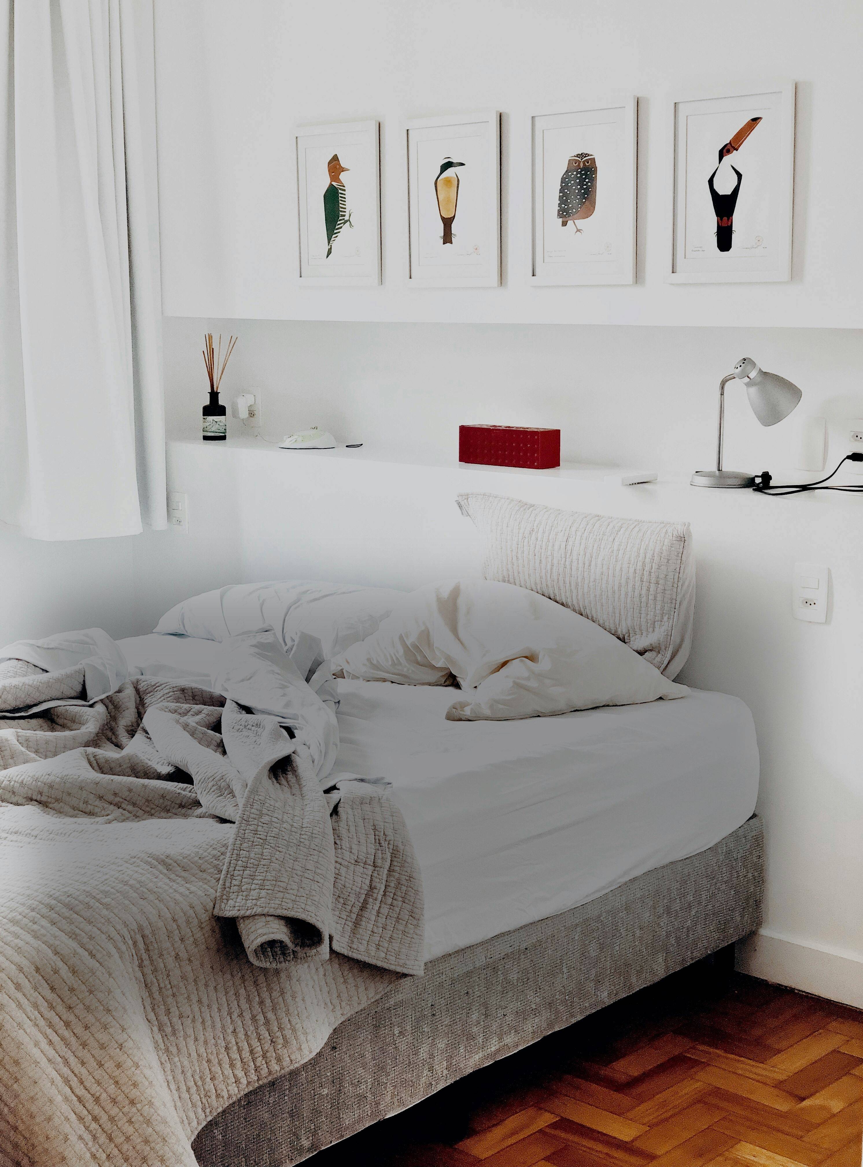 A lifestyle image of a covered mattress on a bed - looking comfortable